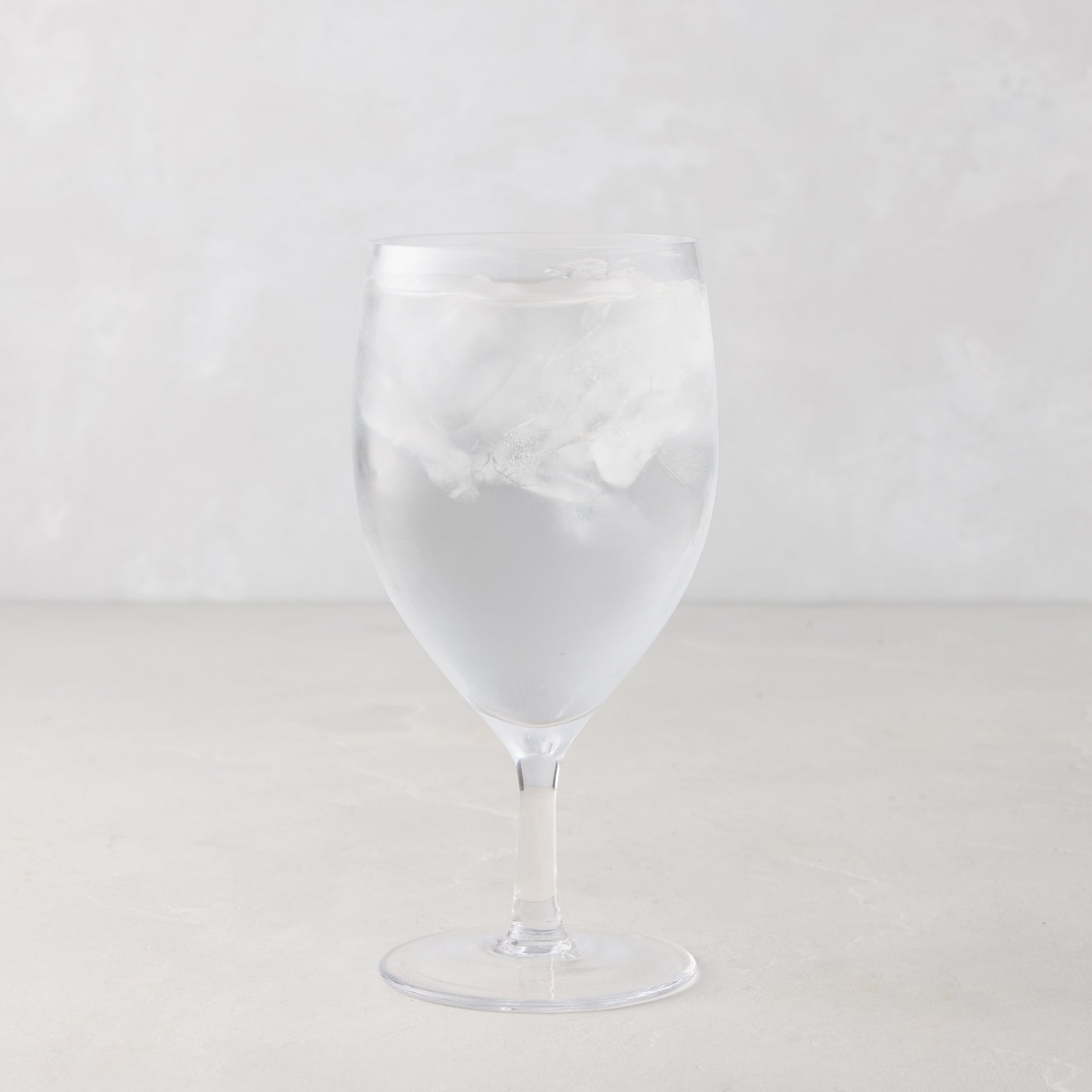HG Heritage Water Glass, clear mouth-blown glass, 6.3"H x 3"Dia, filled with ice water.