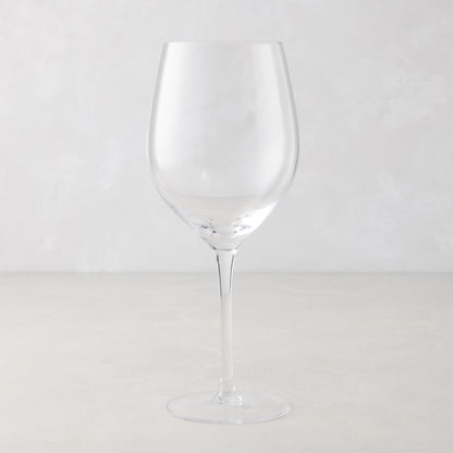 Clear, tall HG Heritage mouth-blown wine glass with a thin stem and wide bowl.