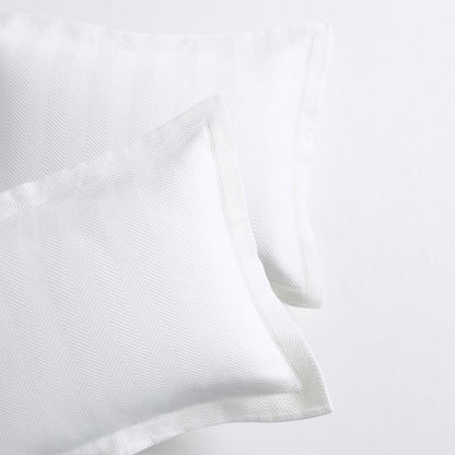 White Herringbone Matelassé Pillow Shams, set of 2, 100% cotton, with a 2” hem.