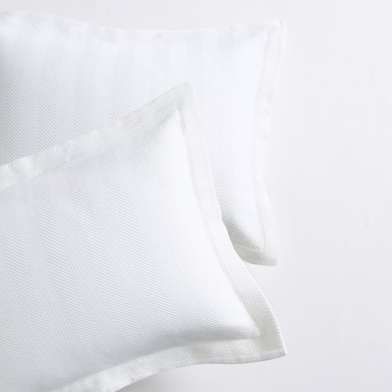 White Herringbone Matelassé Pillow Shams, set of 2, 100% cotton, with a 2” hem.