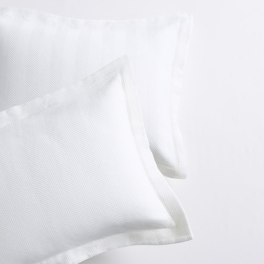 White Herringbone Matelassé Pillow Shams, set of 2, 100% cotton, with a 2” hem.