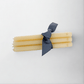 HG Amber Unscented 10" Taper Candle Bundle, set of 5, tied with a dark ribbon.