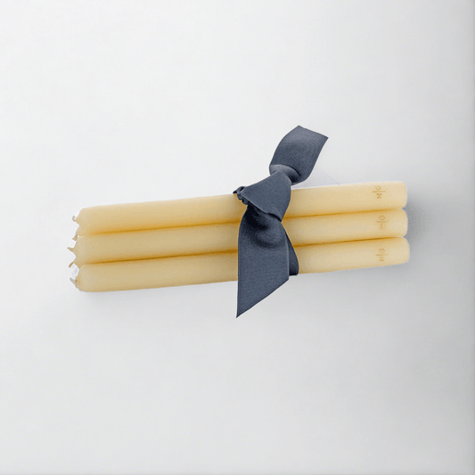 HG Amber Unscented 10" Taper Candle Bundle, set of 5, tied with a dark ribbon.