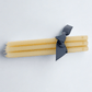 HG Amber Unscented 12" Taper Candle Bundle, set of 5, tied with a dark ribbon, with HG logo.