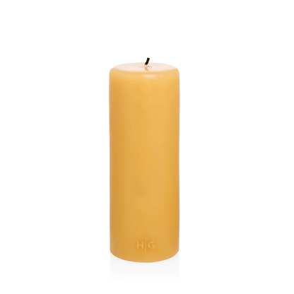 HG Amber Unscented Pillar Candle, 3"x8", made from natural paraffin with a gold HG logo.