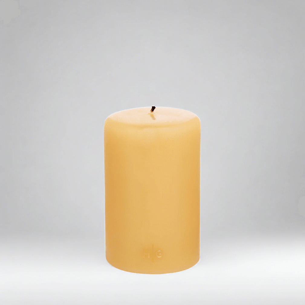 HG Amber Unscented Pillar Candle, 4"x6", with subtle gold HG logo.