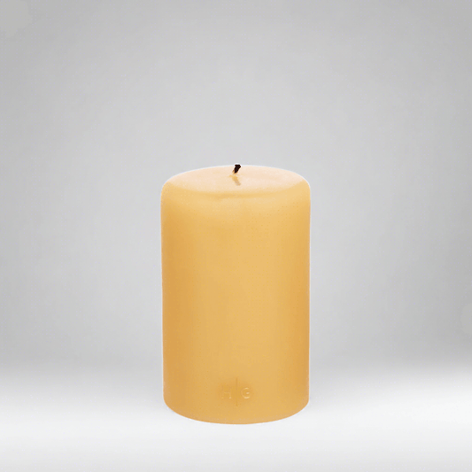 HG Amber Unscented Pillar Candle, 4"x6", with subtle gold HG logo.