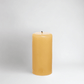 HG Amber Unscented 3"x6" paraffin pillar candle with gold embossed HG logo and cotton wick.