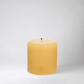 HG Amber Unscented Pillar Candle, 4"x4" paraffin with gold embossed HG logo and cotton wick.