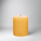 HG Amber Unscented Pillar Candle, 5"x6" paraffin, with gold HG logo and cotton wick.