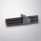 Five 12" black unscented taper candles, hand-dipped paraffin, tied with a gray ribbon, gold HG logo.