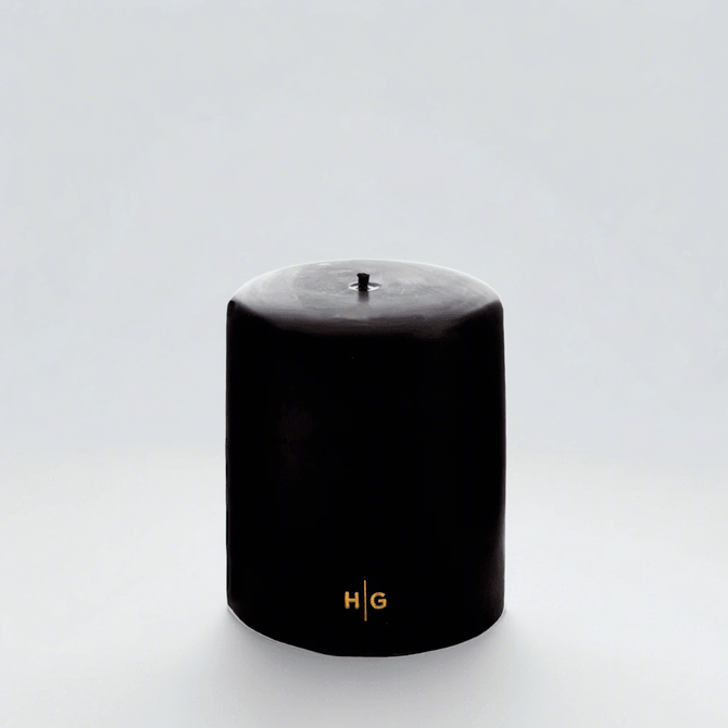 HG Black Unscented Pillar Candle, 5"x6", with gold HG logo and oversized cotton wick.