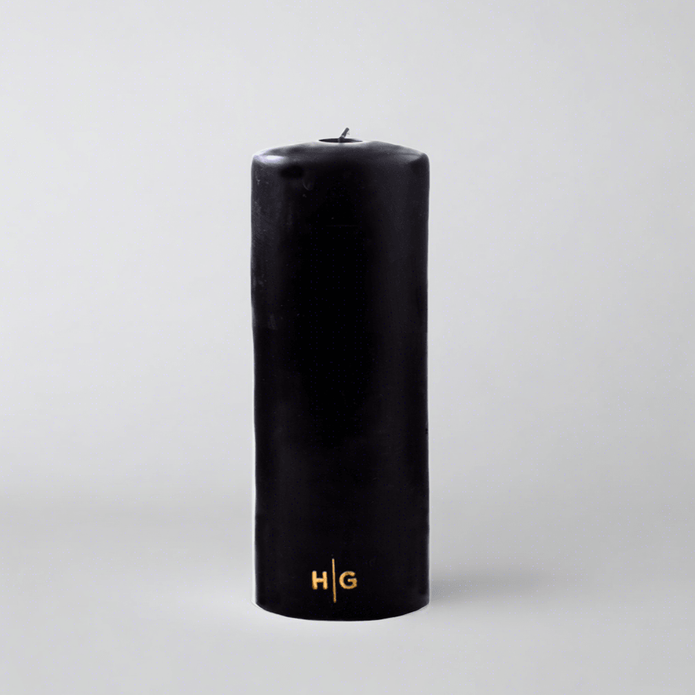 HG Black Unscented Pillar Candle, 3"x8", with gold embossed HG logo.