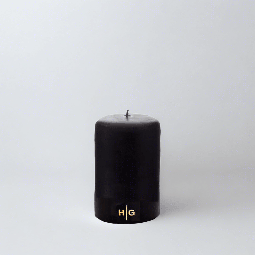 HG Black Unscented Pillar Candle, 3"x4", with gold HG logo, oversized cotton wick.
