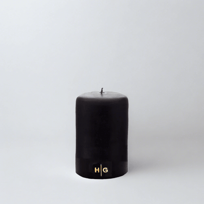 HG Black Unscented Pillar Candle, 3"x4", with gold HG logo, oversized cotton wick.