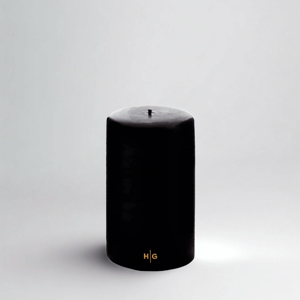 HG Black Unscented Pillar Candle, 4"x6", with gold HG logo.
