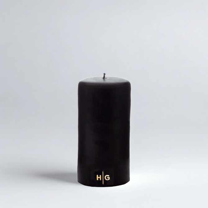 HG Black Unscented Pillar Candle, 3"x6", with a gold embossed HG logo.