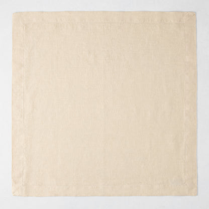HG Buttermilk Hand-Dyed Linen Napkin, 22" square, light beige with mitered corners.