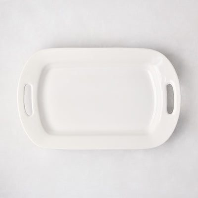 White ceramic serving platter with handles, 11"W x 18"L, from HG Ceramic Medium collection.