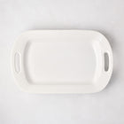 White ceramic serving platter with handles, 11"W x 18"L, from HG Ceramic Medium collection.