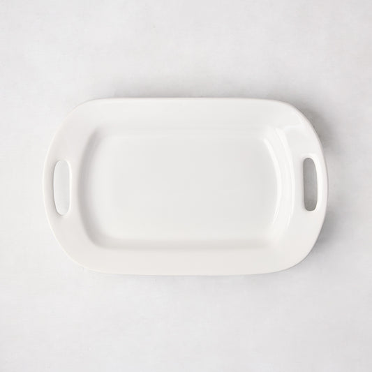 White ceramic small handled serving platter, 15"L x 9"W, with elegant handles.