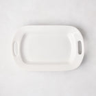 White ceramic small handled serving platter, 15"L x 9"W, with elegant handles.