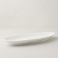HG Classic white porcelain oval serving platter, 18.5" long, with a subtle black rim.