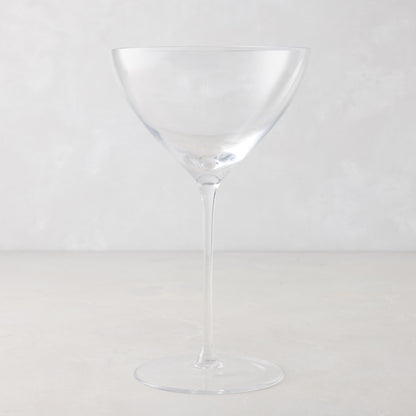 Oversized 14oz mouth-blown clear glass martini glass with a tall, slender stem on a light gray background.