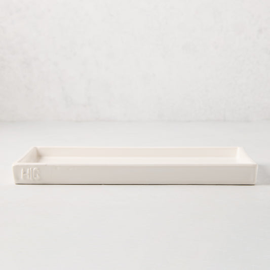 White ceramic HG Large Everyday Tray, 11"L x 5"W, with understated lip and HG monogram.