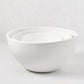 Set of three white, high-fired ceramic HG Modern Serve Bowls, nested.