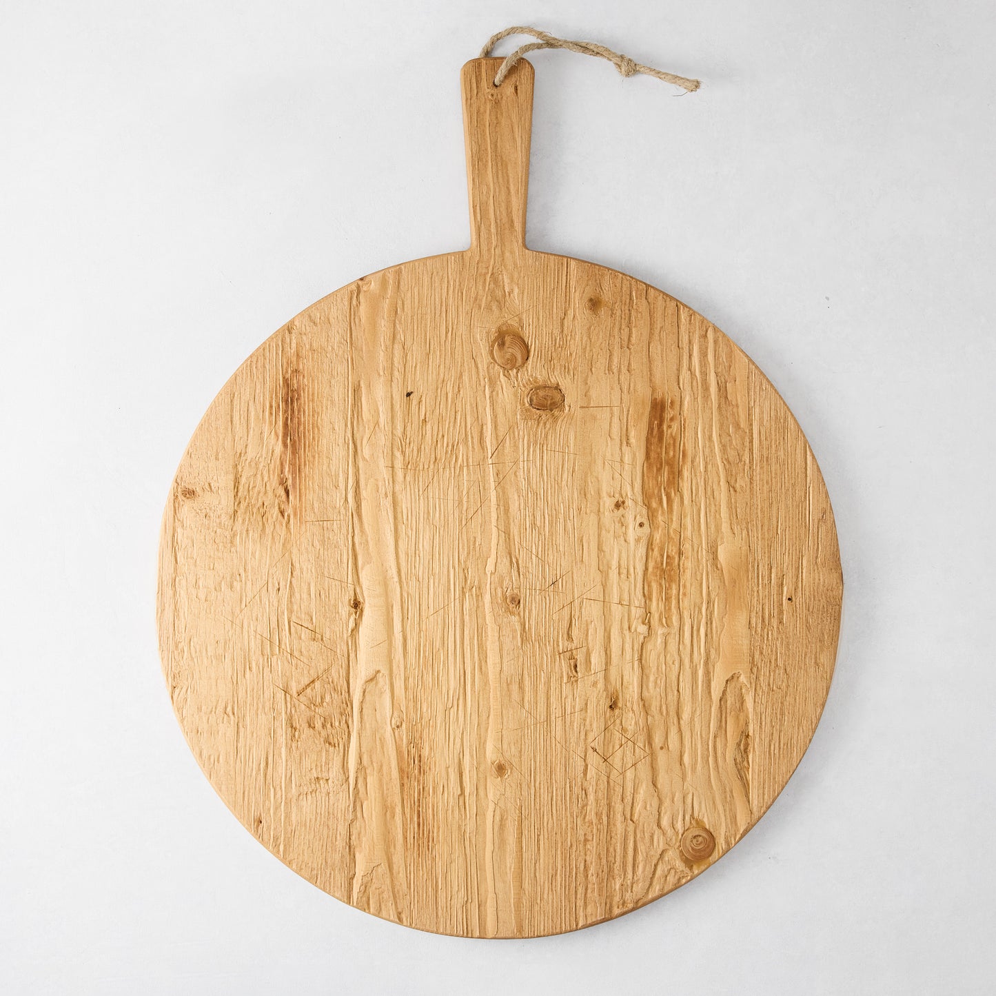 Round reclaimed wood serving board with handle and rope, natural light brown finish, 19.5" diameter.