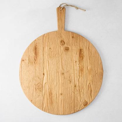 Round reclaimed wood serving board with handle and rope, natural light brown finish, 19.5" diameter.