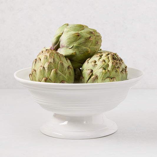 HG Round Ceramic Footed Bowl, 11.5"Dia. x 6"H, white, with three green artichokes.
