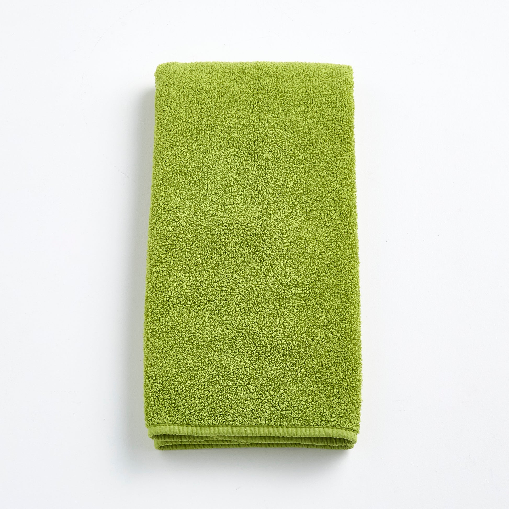 HG Signature aloe green zero twist cotton hand towel, 20x30 inches, with matching bias piping.
