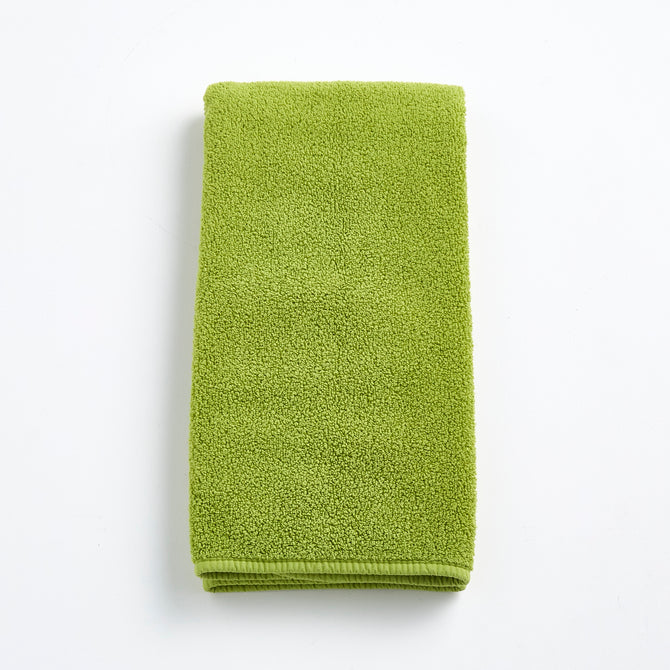 HG Signature aloe green zero twist cotton hand towel, 20x30 inches, with matching bias piping.