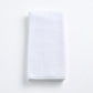 Cloud white Signature hand towel made of soft, folded cotton terry fabric on a clean white background.
