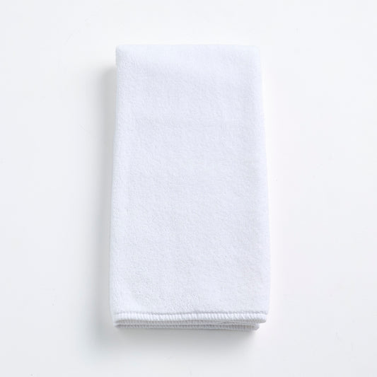 Cloud white Signature hand towel made of soft, folded cotton terry fabric on a clean white background.