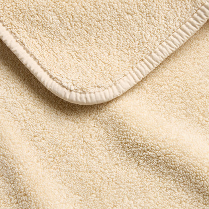 Creme Brulee signature hand towel with a soft, textured terry cloth finish and a clean, stitched hem border.