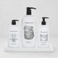 Hudson Grace kitchen set with dish soap, hand soap, and hand lotion in white bottles on a creamy white marble tray.