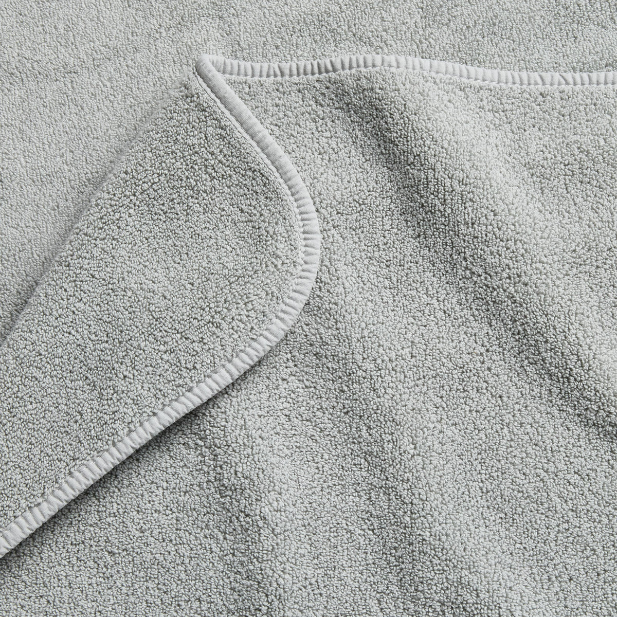 Mist blue Signature bath towel with a soft, plush terry texture and finished hem detail.