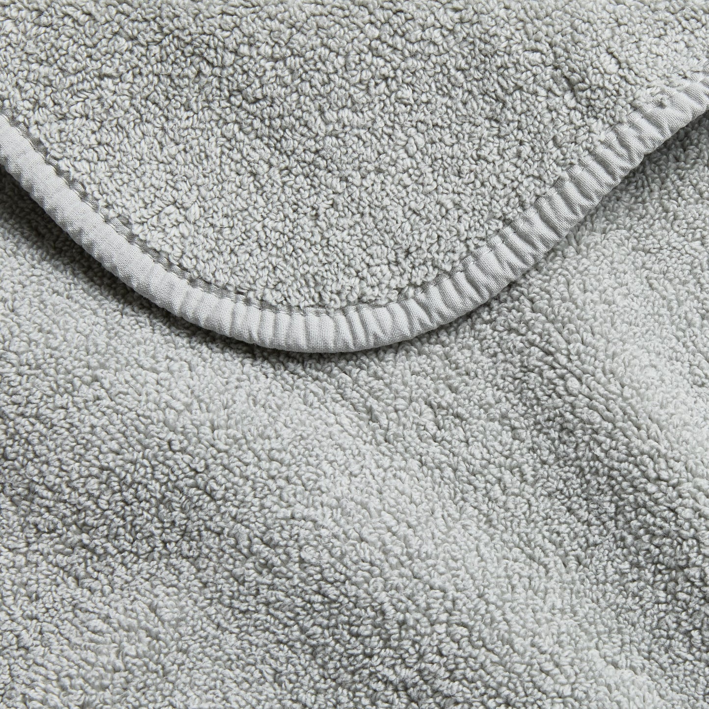 Mist blue Signature hand towel featuring a soft, absorbent cotton terry texture and a finished stitched edge.
