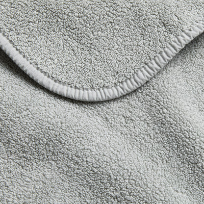 Mist blue Signature hand towel featuring a soft, absorbent cotton terry texture and a finished stitched edge.
