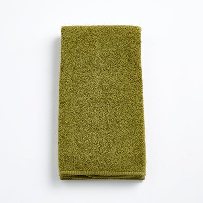 Olive green zero-twist cotton hand towel, 20x30 inches, featuring textured terry fabric and finished bias piping.