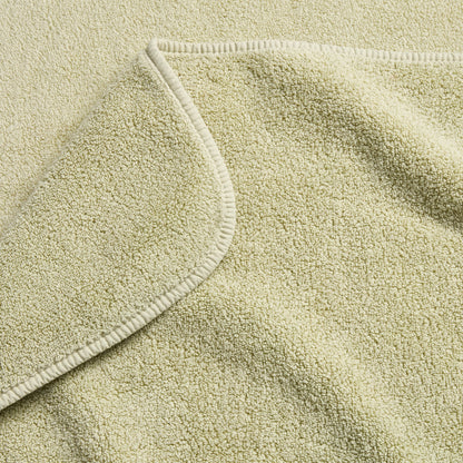 Sage green Signature bath towel with a soft, plush terry texture and a finished stitched hem.