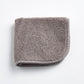 Stone grey HG Signature washcloth in a soft, textured cotton terry fabric with a finished stitched border.