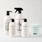 HG Sweet Basil Cleaning Gift Set: white bottles with black pumps, kitchen candle.