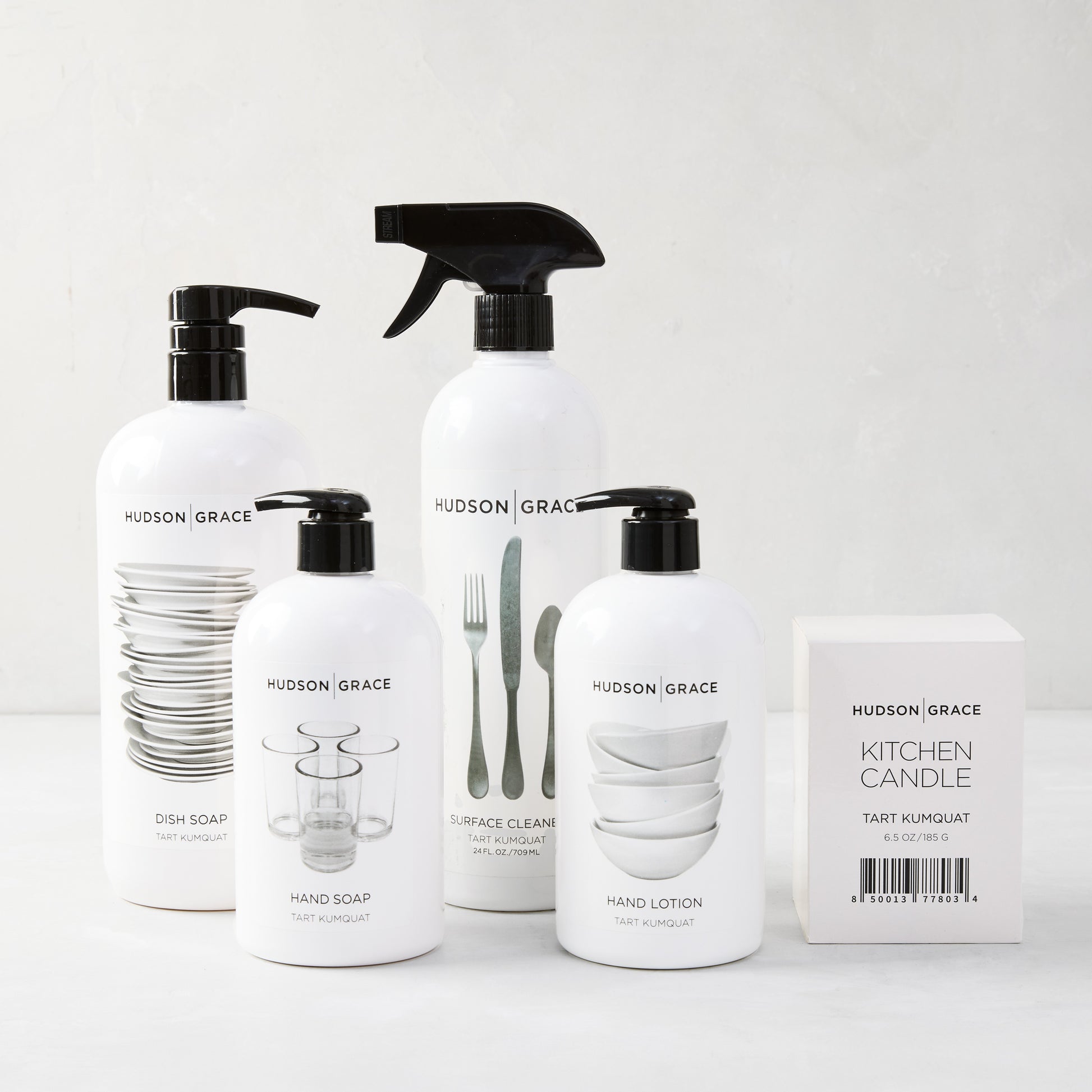 White Hudson Grace Tart Kumquat cleaning gift set: dish soap, hand soap, hand lotion, surface cleaner, and kitchen candle.