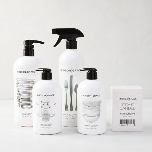 White Hudson Grace Tart Kumquat cleaning gift set: dish soap, hand soap, hand lotion, surface cleaner, and kitchen candle.