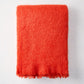 Folded Hibiscus Orange Mohair Throw Blanket, 72"L x 51"W, with a soft, textured finish.