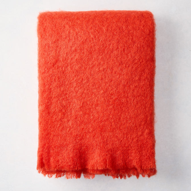 Folded Hibiscus Orange Mohair Throw Blanket, 72"L x 51"W, with a soft, textured finish.